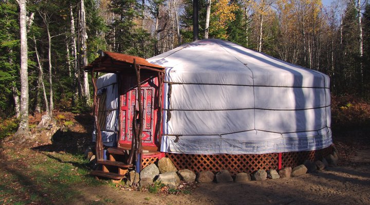 Yurt and camping A white and red yurt at an outfitter.