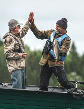 A father and son feasting after fishing 
