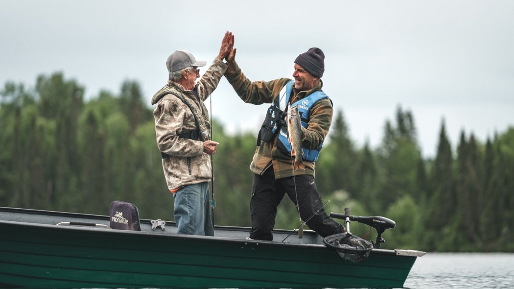 A father and son feasting after fishing