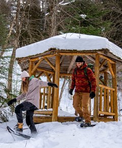 A couple snowshoeing at an outfitter