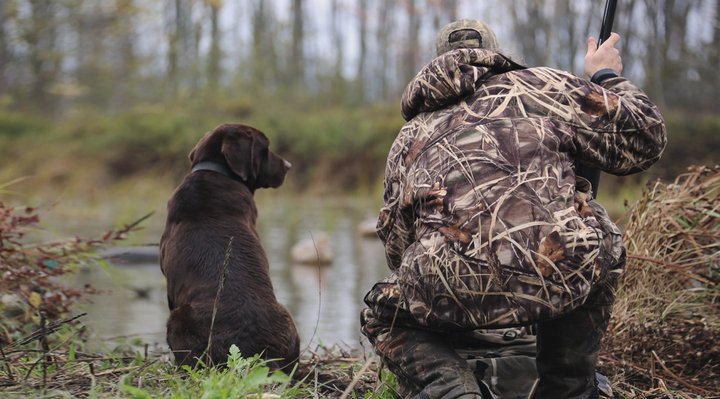 A hunter and his dog.
