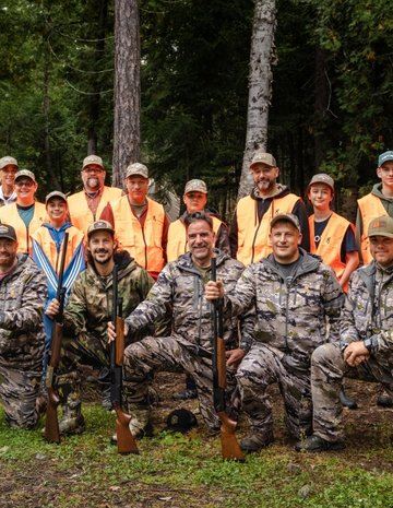 Group of hunters and their students 