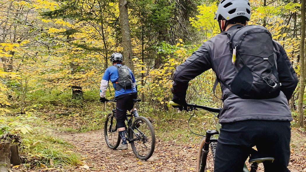 Mountain bikes at in outfitters Two men ride their bikes to an outfitter.