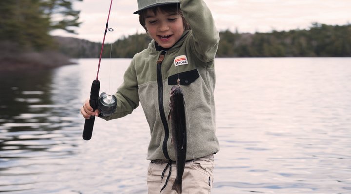 Young boy with a fish.