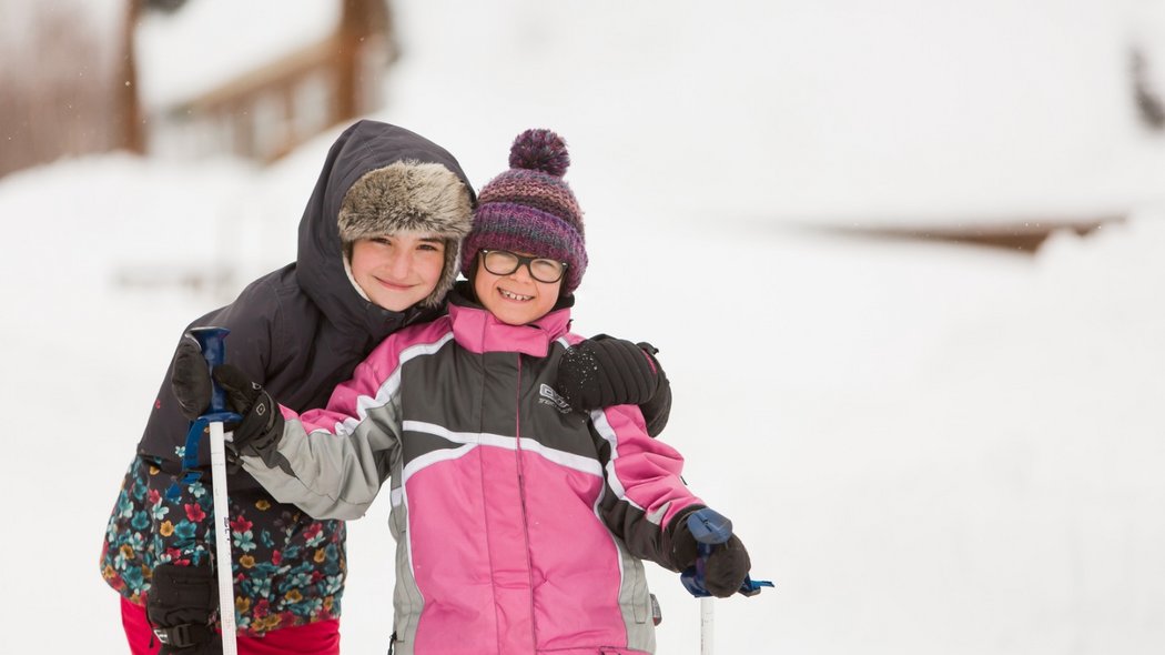 Two children snowshoeing in outfitters