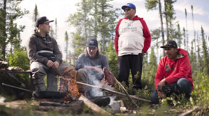 People making a fire in the forest