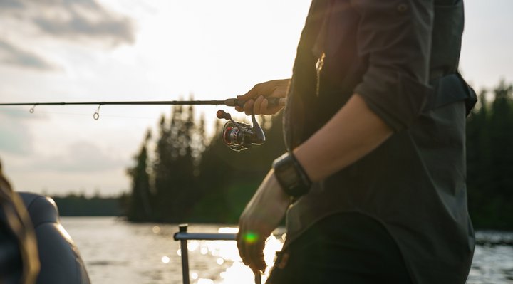 Zoom on a fisherman in a boat.