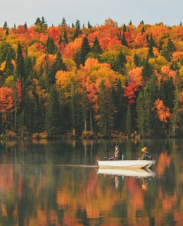 Two fishermen in an autumn landscape