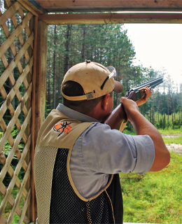 Man shooting a clay shooting.