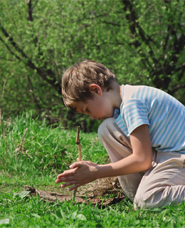 A child trying to build a fire