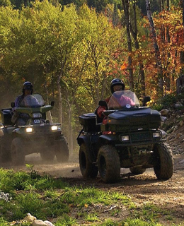 Two people on ATV in autumn
