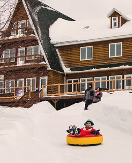 A child sliding on an inner tube 