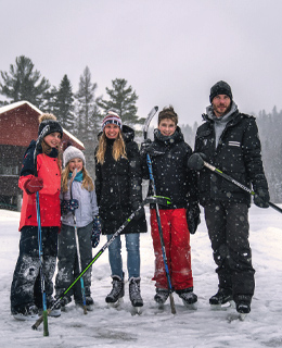 A family skating on the lake