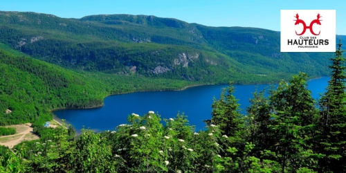 Aerial view of the lake and forest at Club des Hauteurs