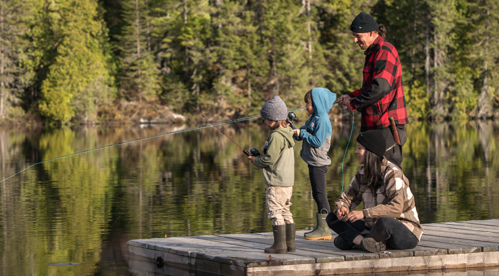 A family fishing on the dock